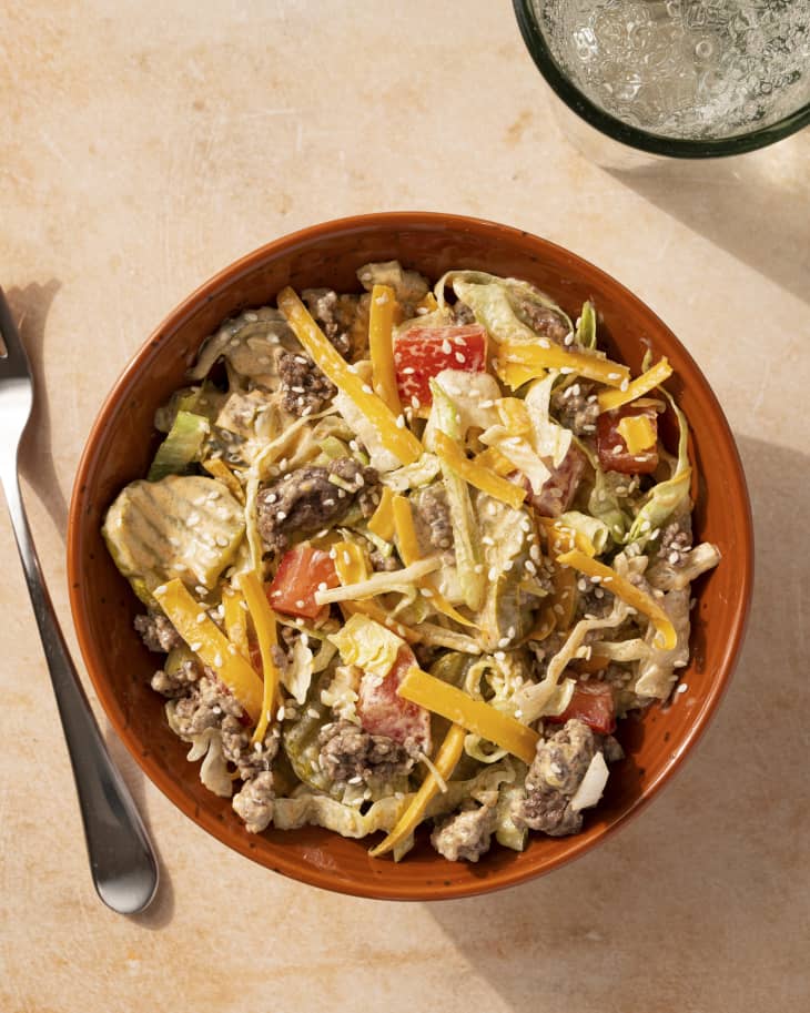 a Big Mac salad (a gluten-free, keto cheeseburger salad with pickles, lettuce, cheese, and ground beef) in a bowl, as seen from above