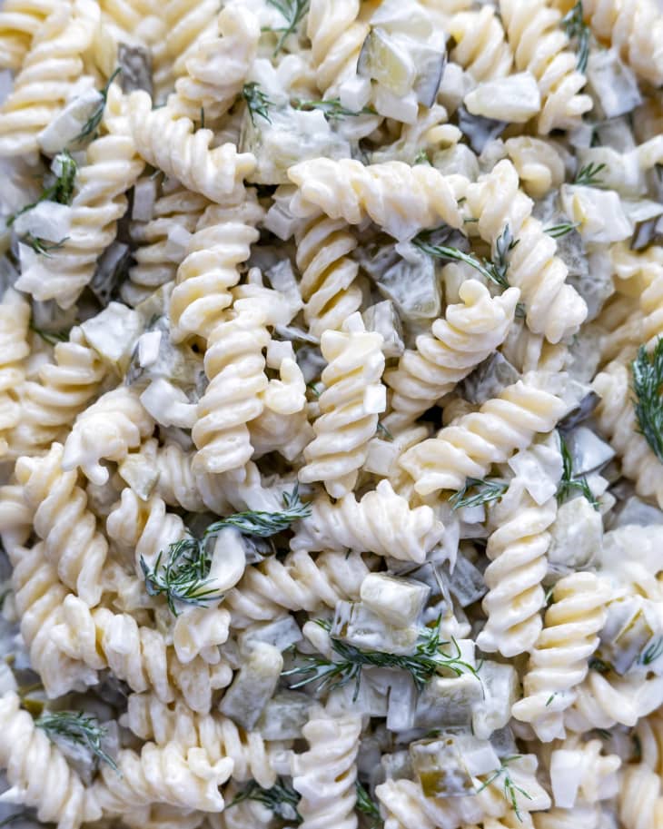 A closeup photo of pasta salad made with a spiral pasta.