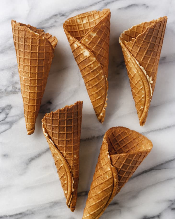 5 waffle cones on a marble background.