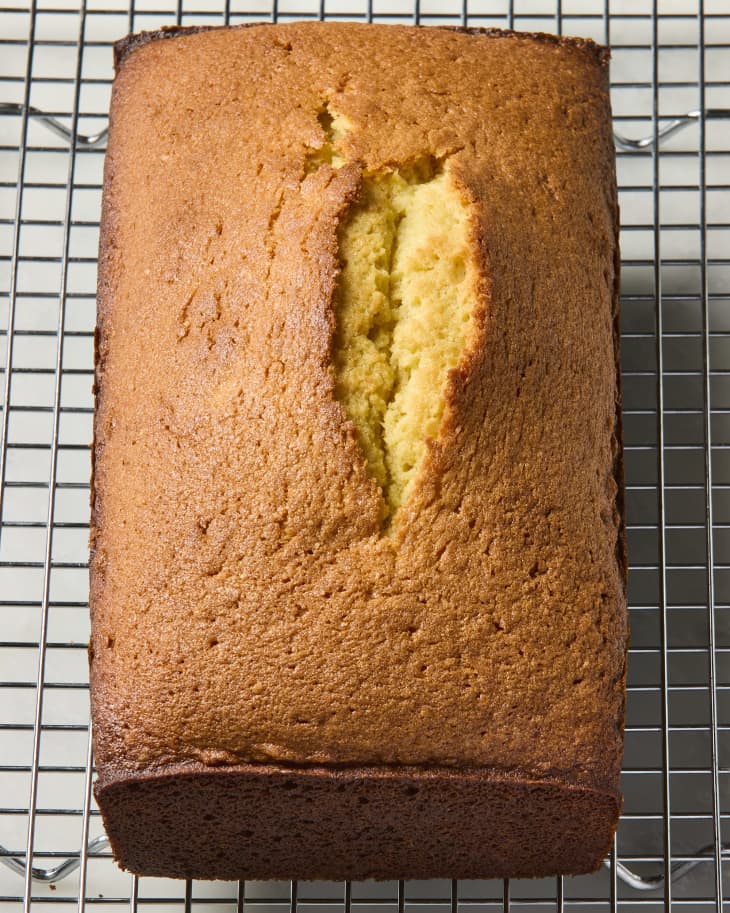overhead shot of a pound cake loaf, on a cooling rack.