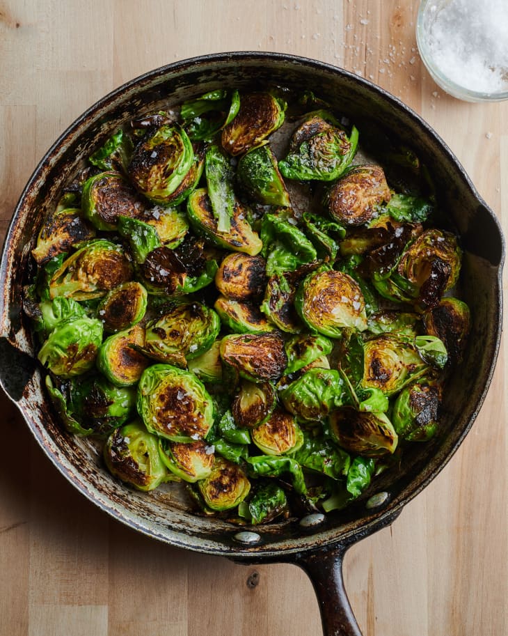Sautéed Brussels sprouts in skillet.