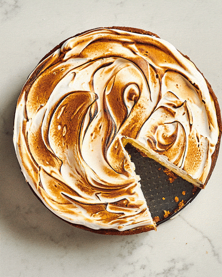 gif of lemon meringue cheesecake being torched to brown