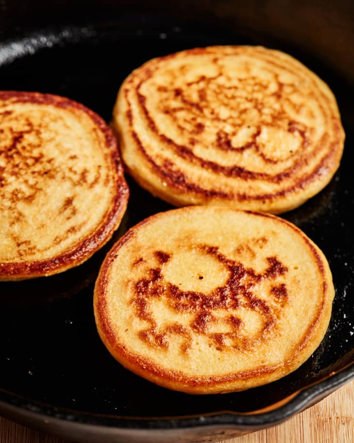 three johhny cakes are being cooked in a pan