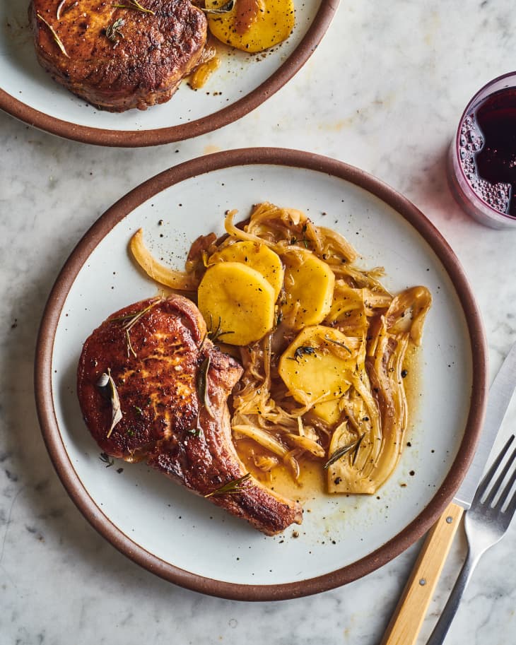 italian inspired pork chops on a plate with potatoes
