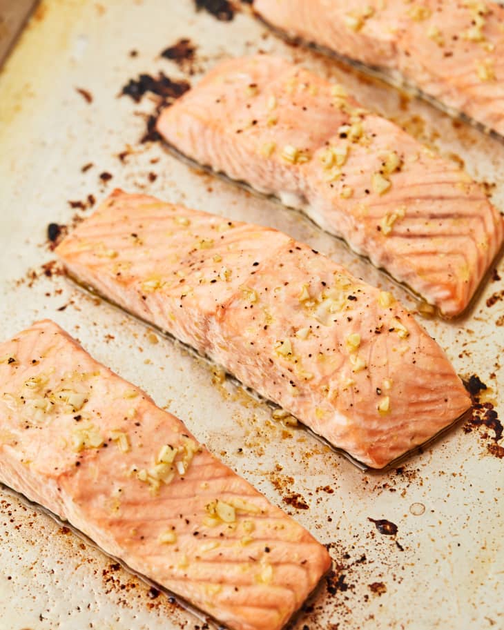 salmon roasting on a sheet pan
