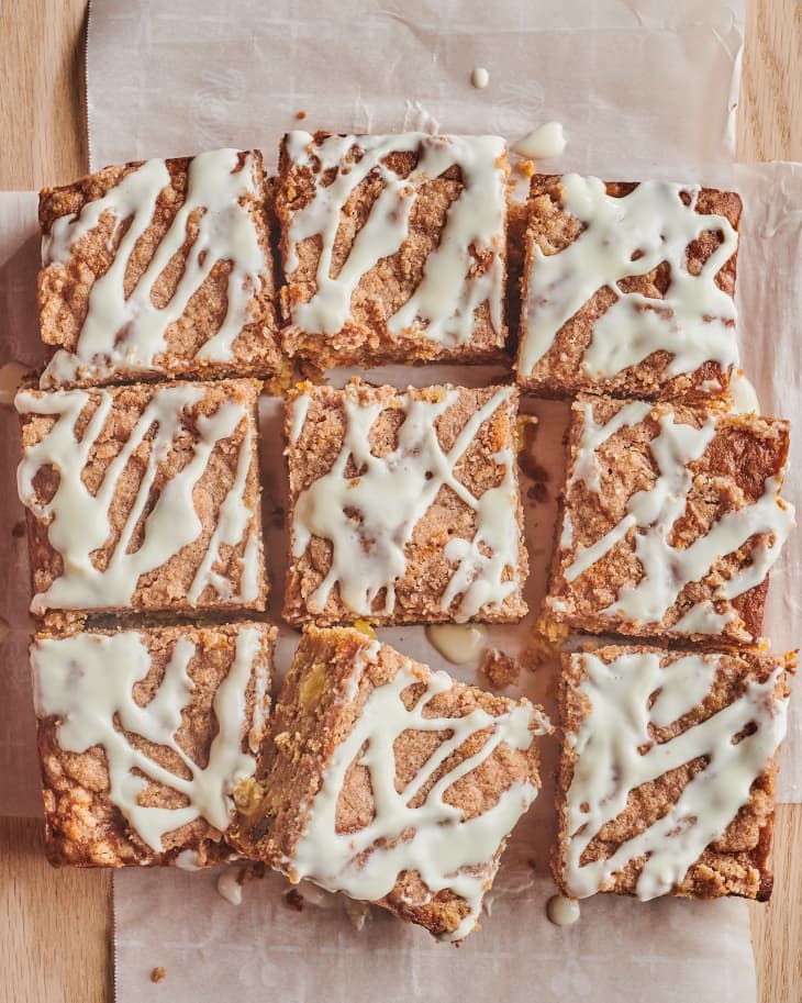 carrot cake coffee cake on parchment paper, sliced into 9
