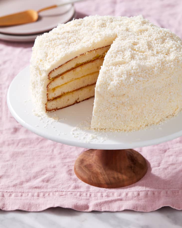 lemon coconut cake on a cake stand