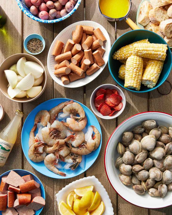 ingredients to make clam boil on a table