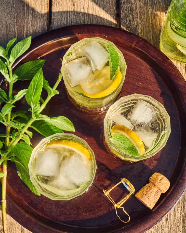 glasses of pitcher spritzer on a bamboo tray