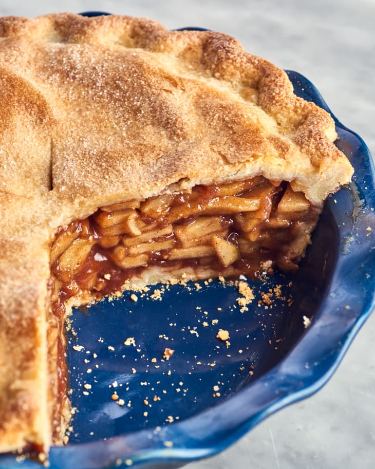 apple pie in deep dish with slice out