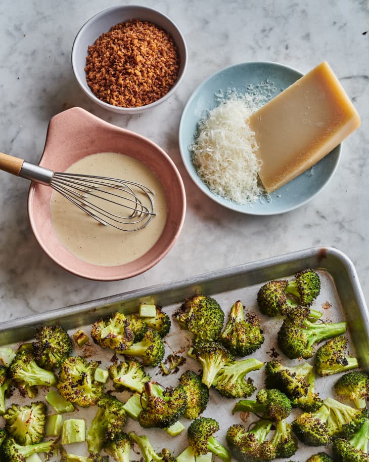 broccoli on a table with caesar dressing