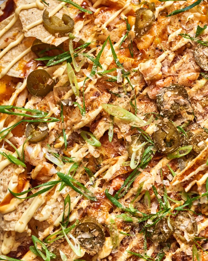 sheetpan of nachos at table, closeup