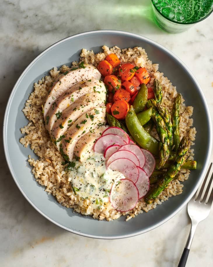 Herby chicken grain bowl on countertop