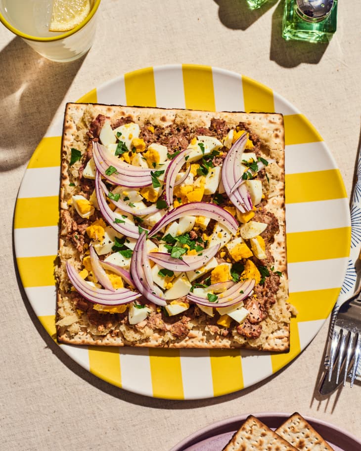 Matzo Sandwiches with Chopped Liver, Onions, &amp; Egg--open faced on plate at table