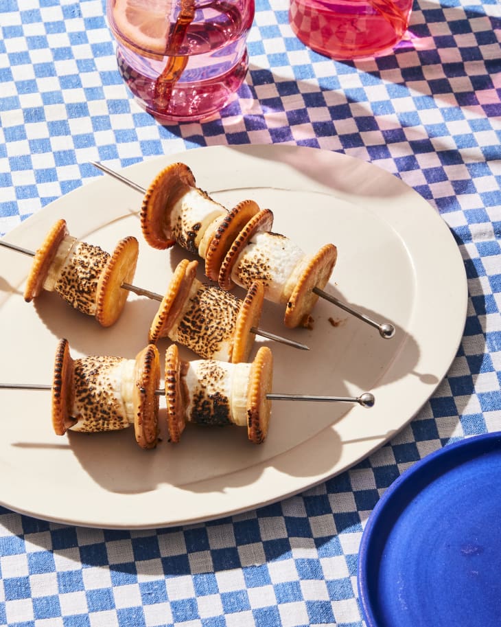 stores skewers on a plate with blue checkered background
