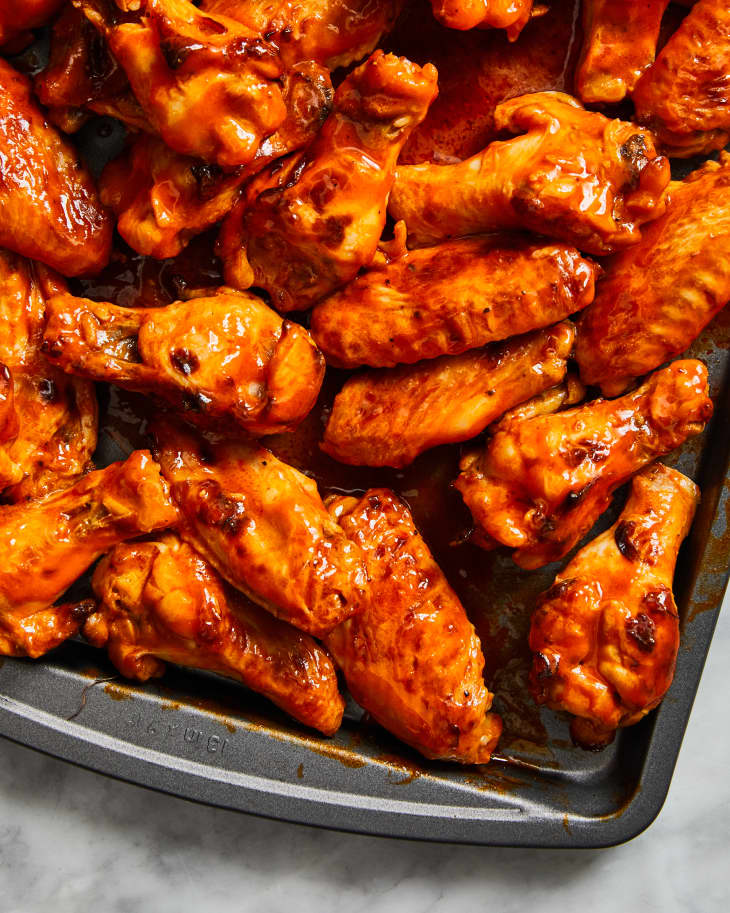 close up of chicken wings in a pan