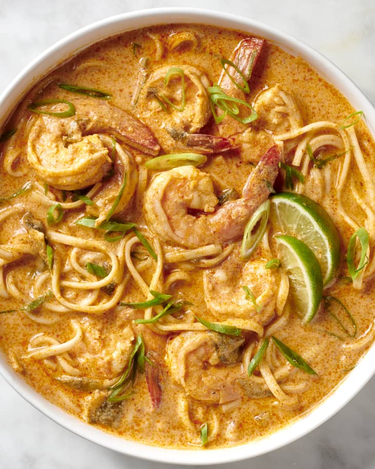 bowl of shrimp curry on a white marble surface