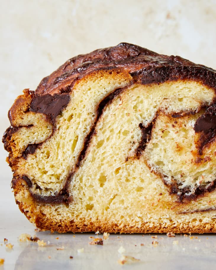 Cross section of a chocolate babka showing the texture and braided in chocolate.