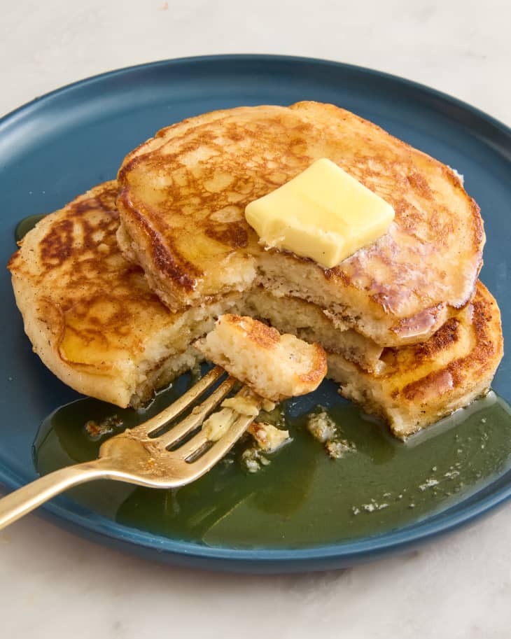 pancakes on a plate with butter and syrup