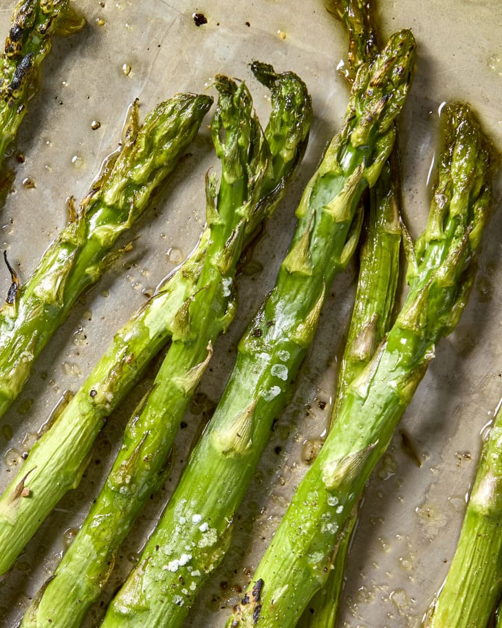 Fully cooked asparagus on a sheet pan.