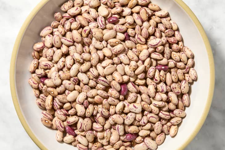 overhead shot of uncooked beans in a bowl