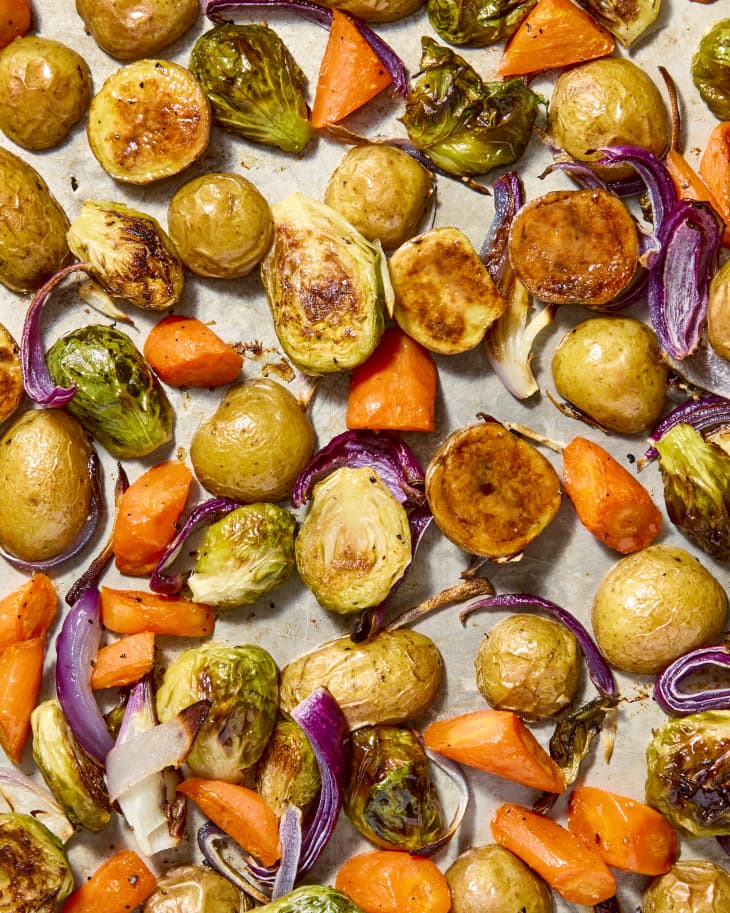 shot of assorted roasted veggies on a baking sheet.