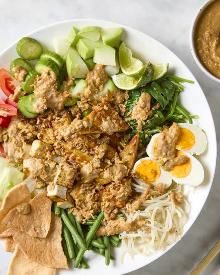 overhead shot of gado gado topped with fried onions.