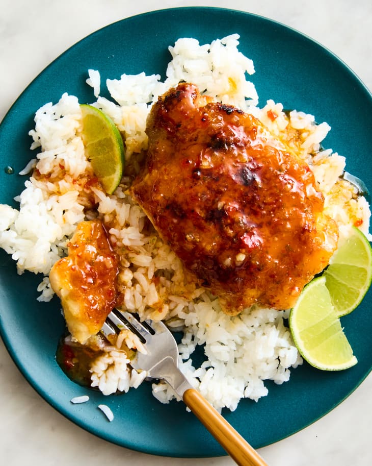 sweet chili chicken thigh over rice with limes
