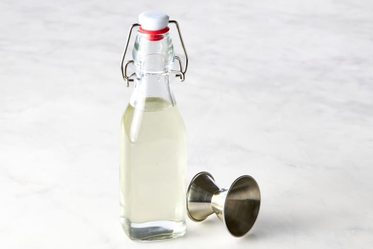 head on shot of simple syrup in a small glass bottle