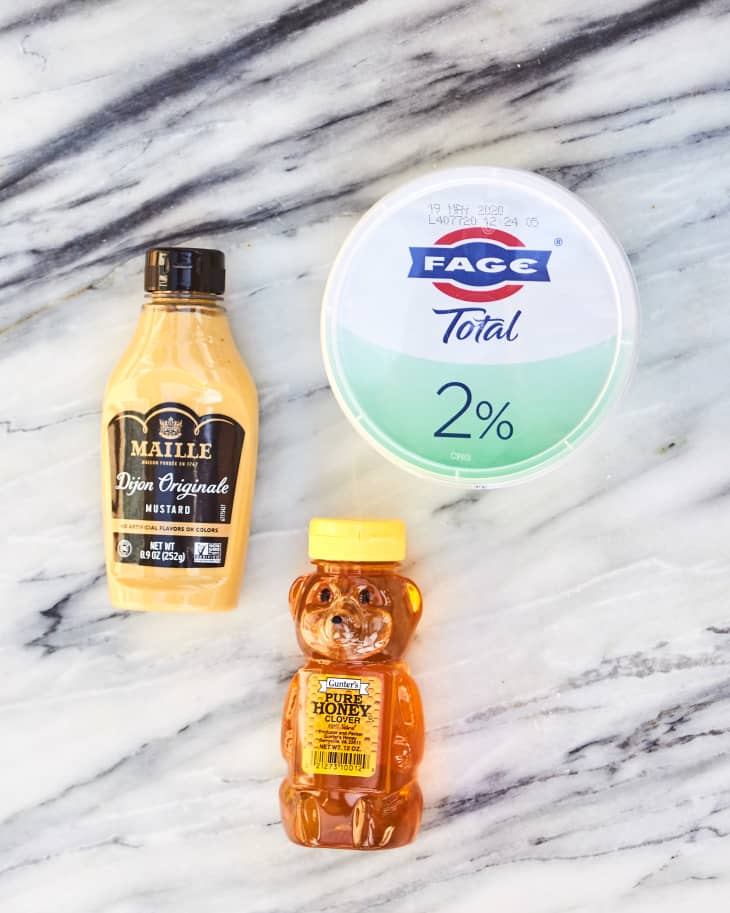 Mustard, honey, and greek yogurt on counter