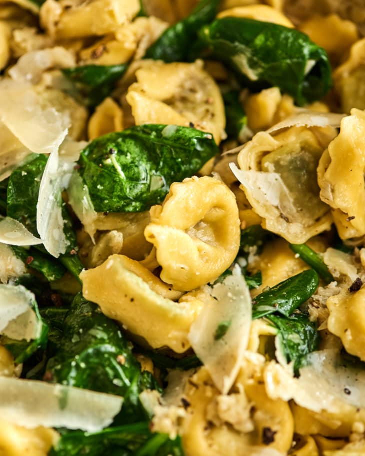Closeup of tortellini and spinach