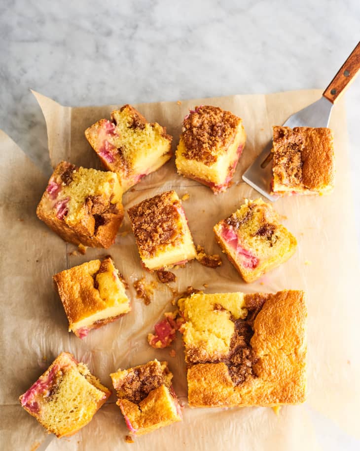 cut up rhubarb coffee cake on parchment paper