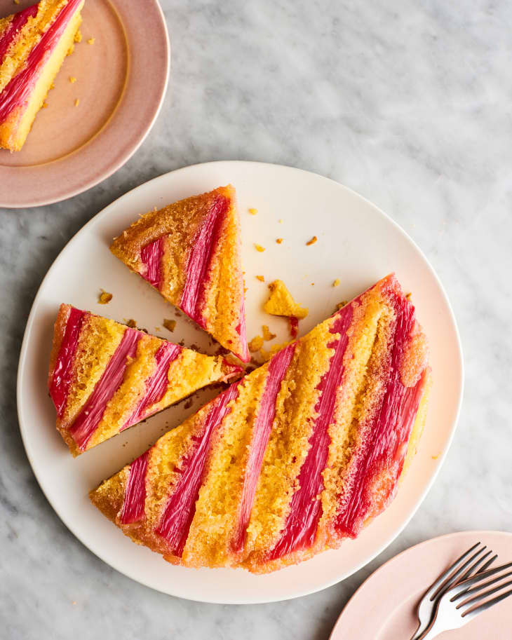 Rhubarb upside down cake, on a platter sliced