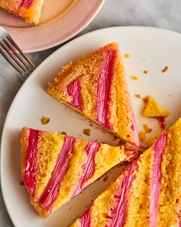 Closeup of sliced rhubarb upside down cake on a platter