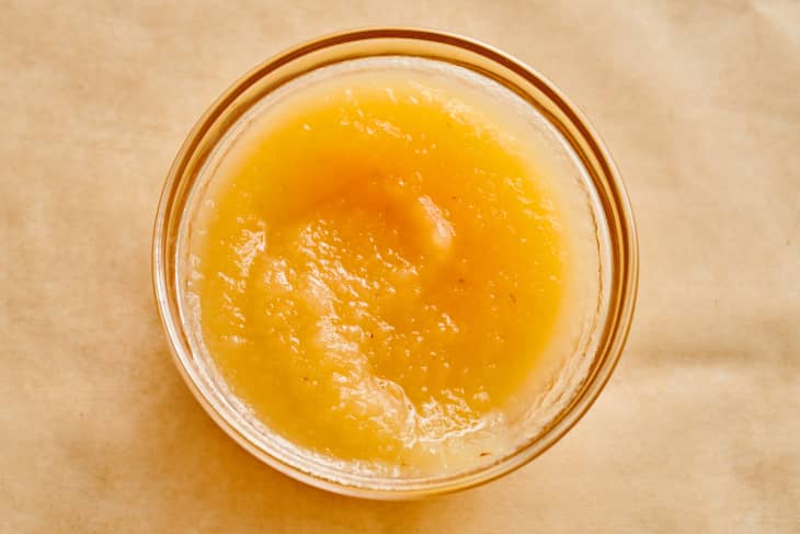 Applesauce in a small glass bowl.