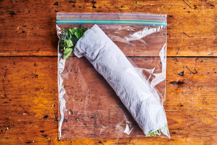 parsley rolled in paper towels like a cigar and in a large zip-top baggie
