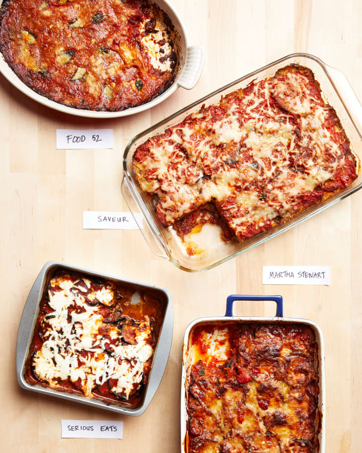 Various baked eggplant parmesans labeled on wooden counterop. Top to bottom: Food 52, Saveur, Martha Stewart, Serious Eats