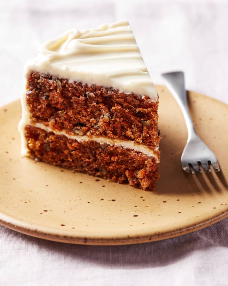 King Arthur Flour carrot cake slice on dessert plate with fork on side.
