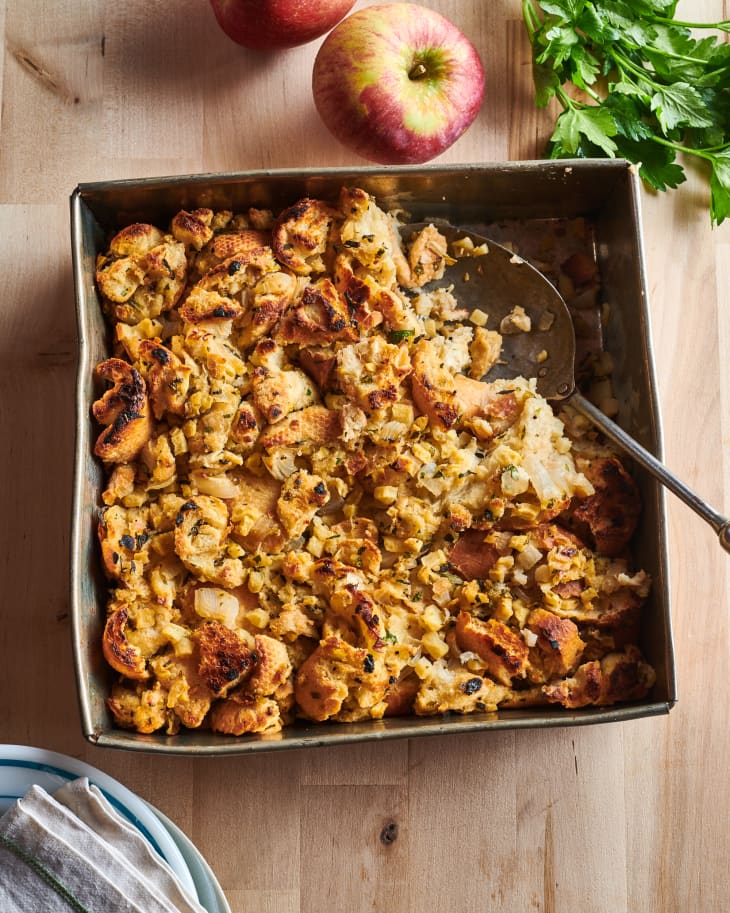 Smitten Kitchen's “Apple-Herb Stuffing for All Seasons” with scoop served out.