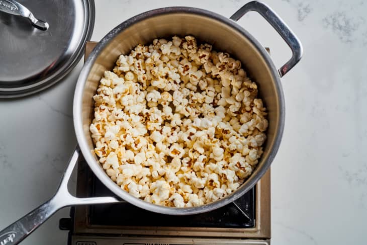 popcorn sits in a large pot on a burner