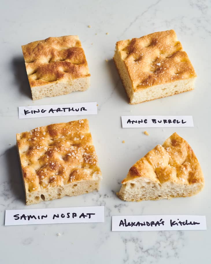 four slices of focaccia bread on a table with labels