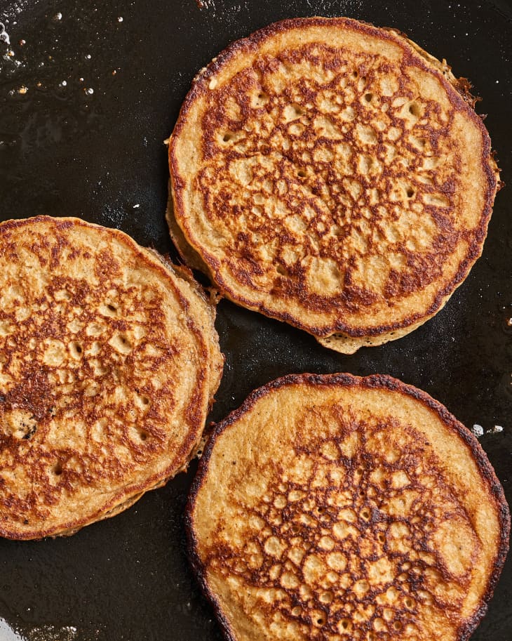pancakes cooking on cast iron
