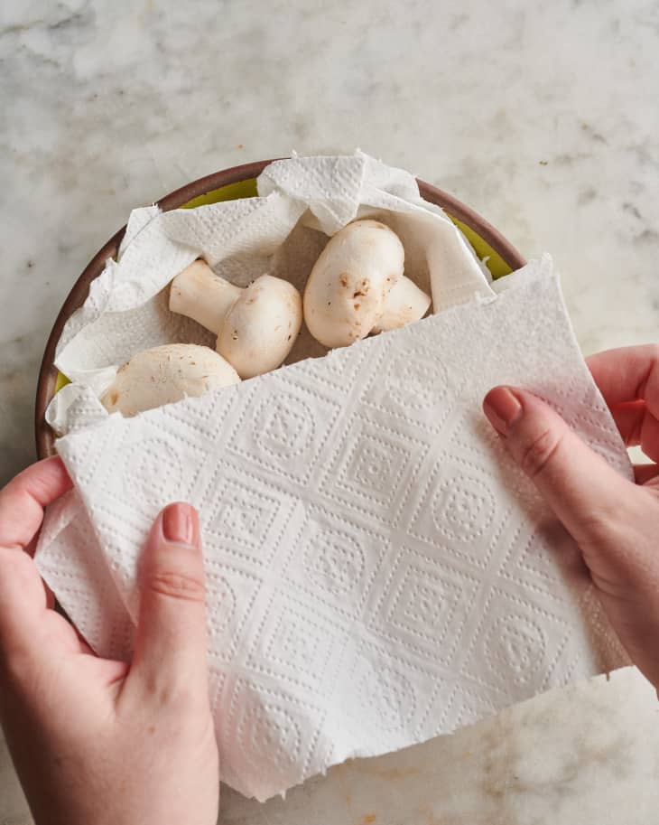 mushrooms in bowl with paper towel