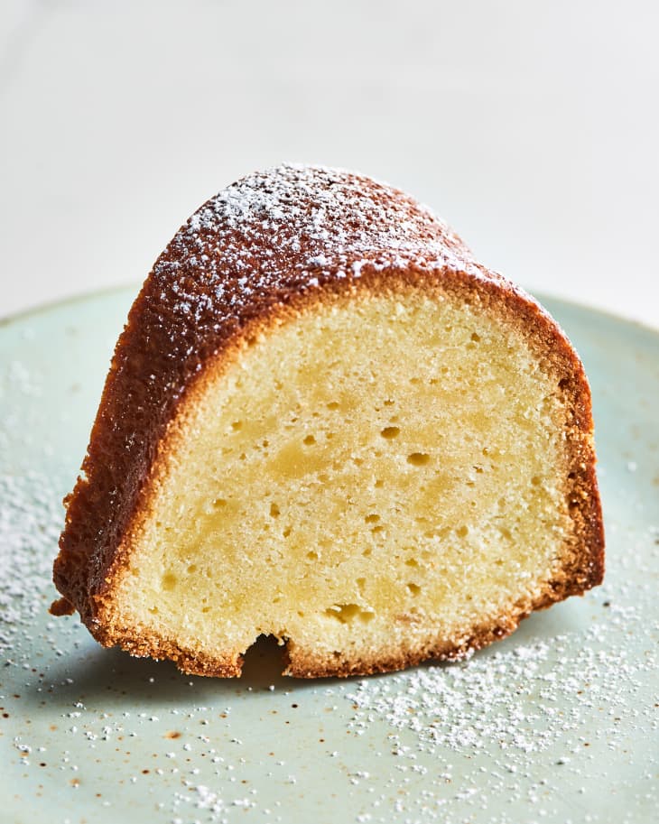 slice of pound cake on plate with powdered sugar