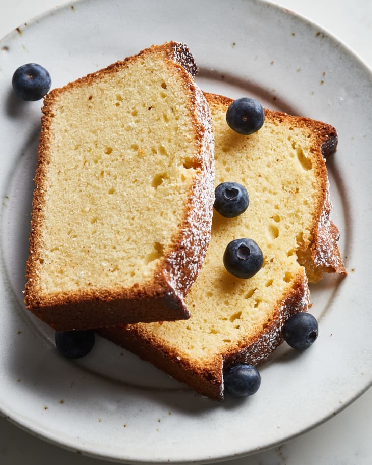 slices of pound cake on a plate with blueberries