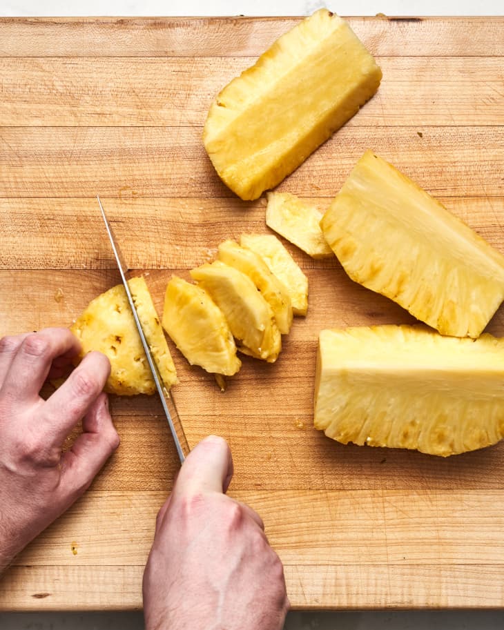 sliced pineapple on a cutting board
