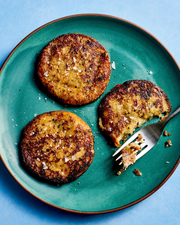 potato and caraway seed cakes on a green plate