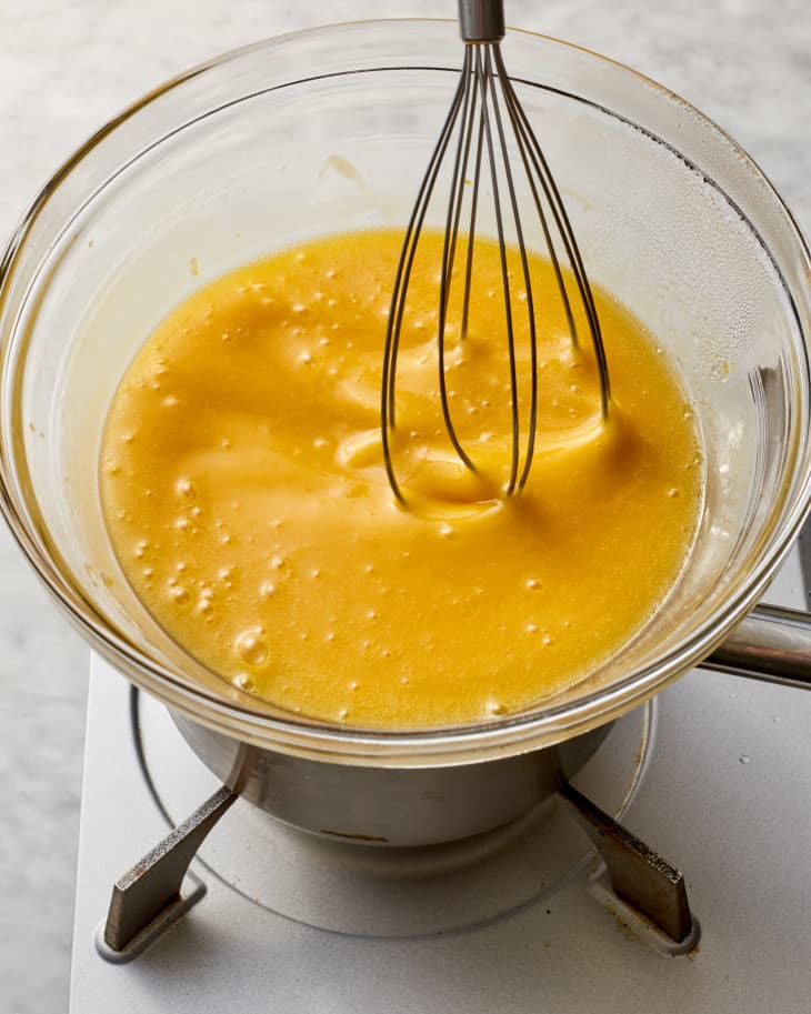 lemon curd being stirred in a double boiler