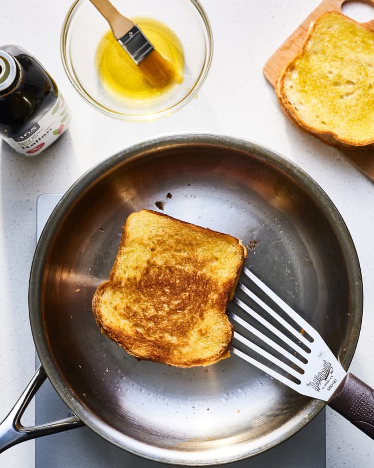 grilled cheese being cooked in olive oil