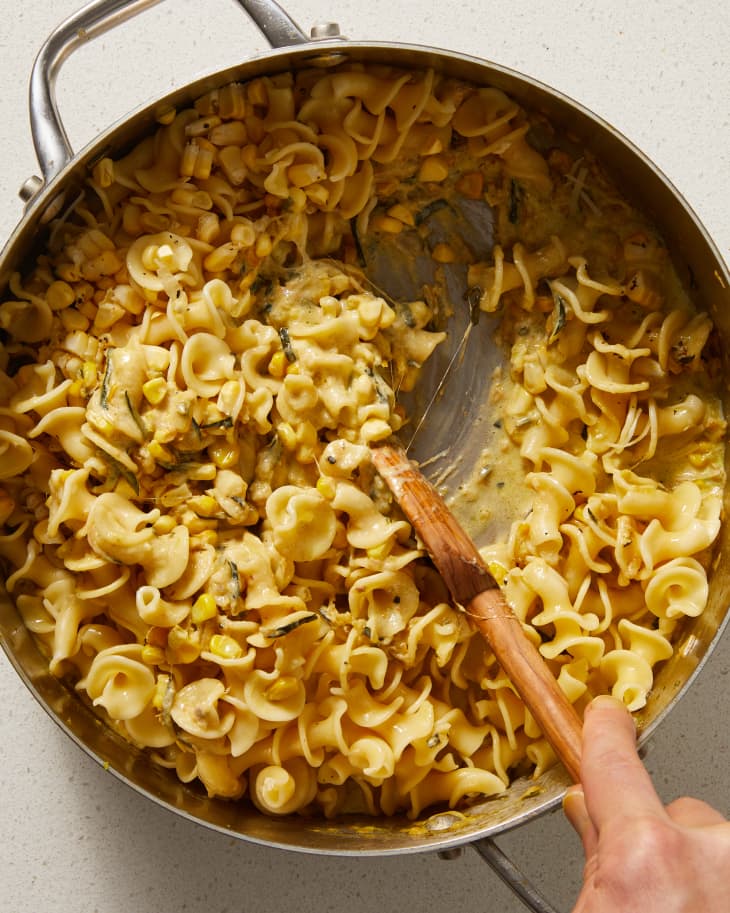 garlic pasta in a pot being stirred